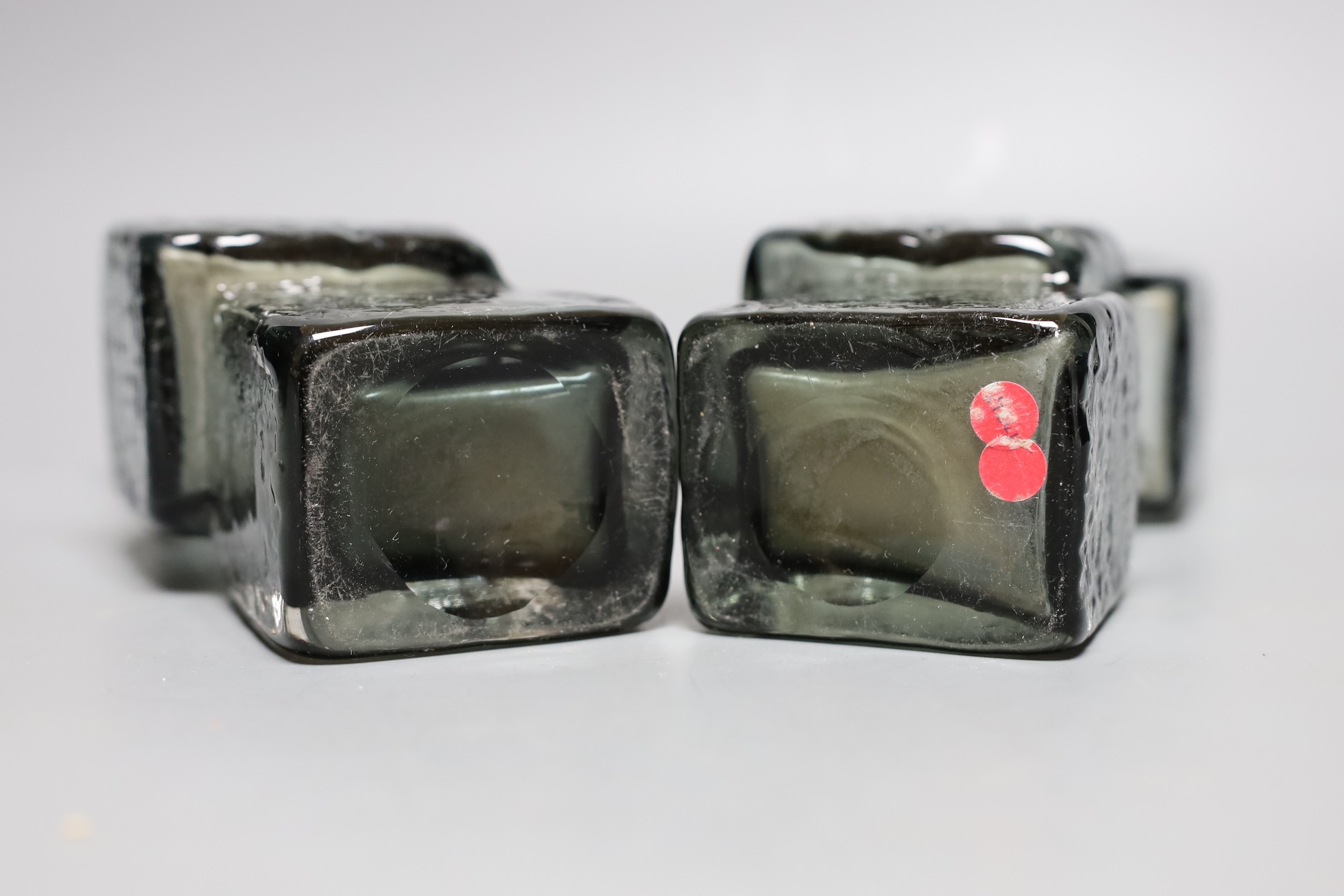 A pair of Whitefriars 'Drunken Bricklayer's' glass vases, designed by Geoffrey Baxter, pattern number 9673, smoked glass, 20cm tall